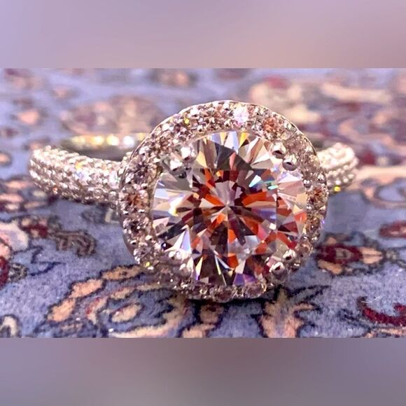 Jewelry - Size 7 solitaire with halo and beautiful band setting . Over 3 carats of stones